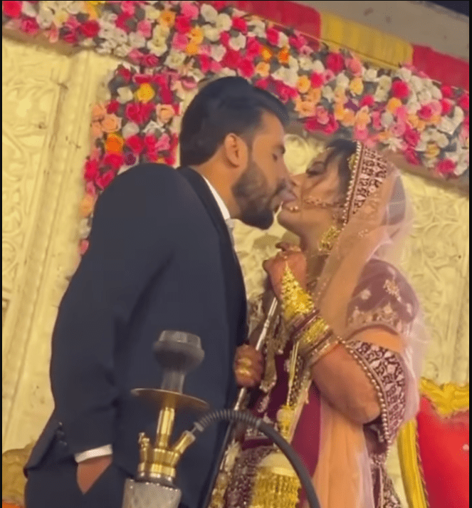 the-bride-abd-groom-were-smoking-hookah-on-the-stage-at-their-wedding